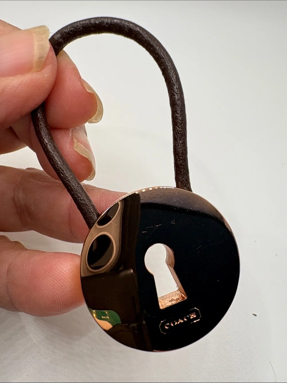 Coach Rose Gold Tone and Brown Leather Strap Charm keychain